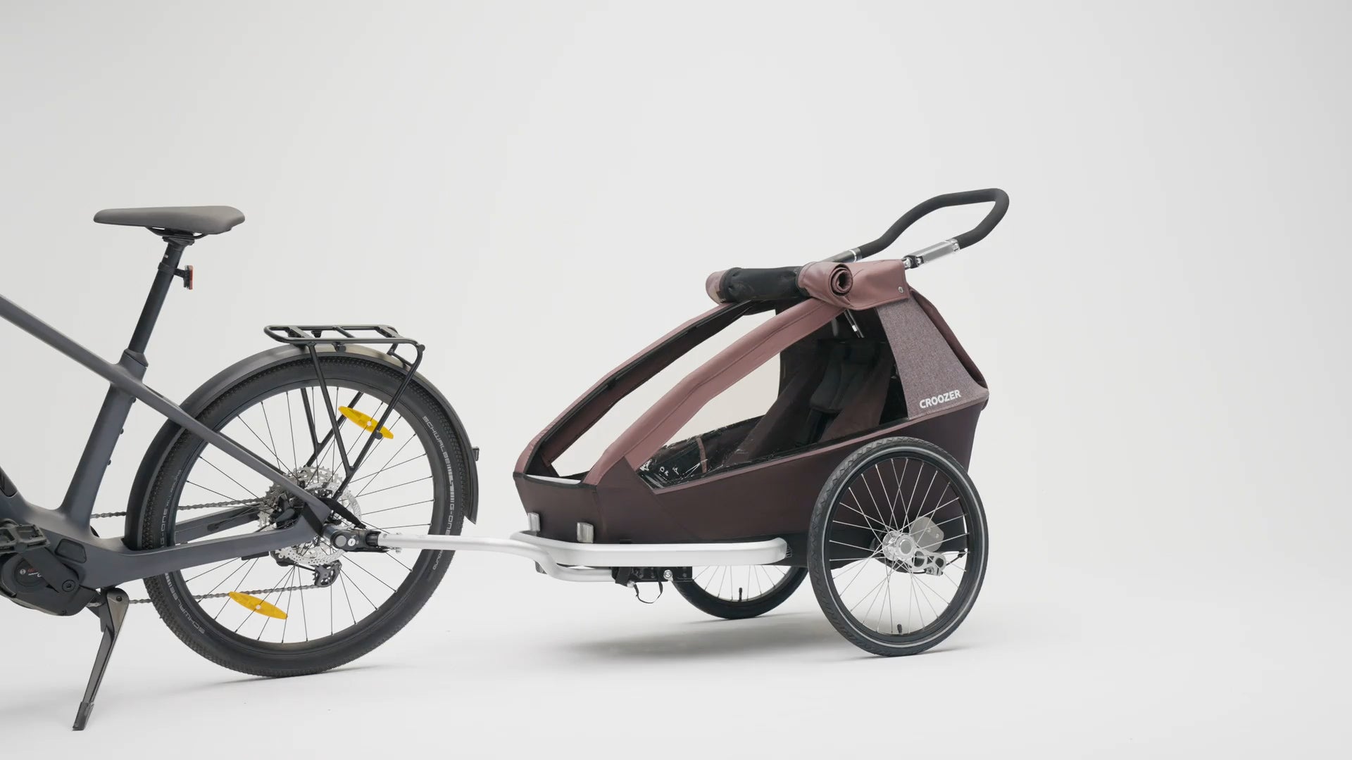 Croozer Kid Vaaya one-seater attached to bike - side view